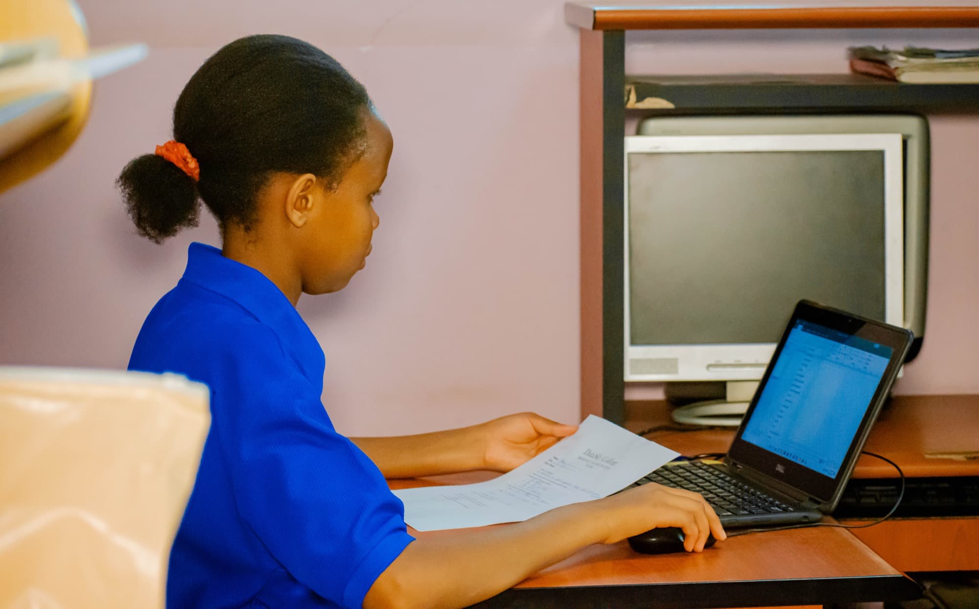 A student preparing coursework on a computer ahead of application