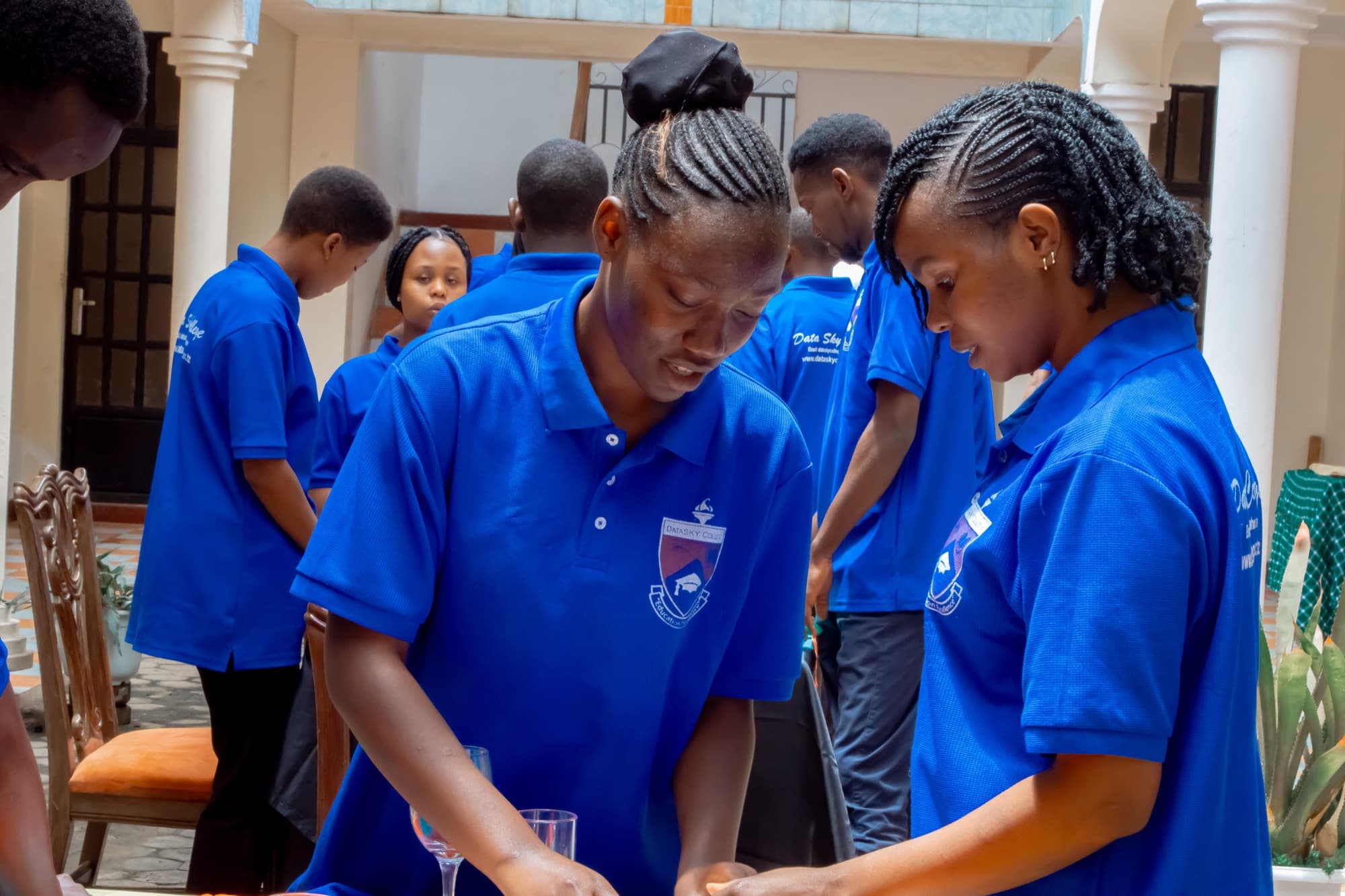 Datasky College students working together on a hands-on exercise in the college courtyard