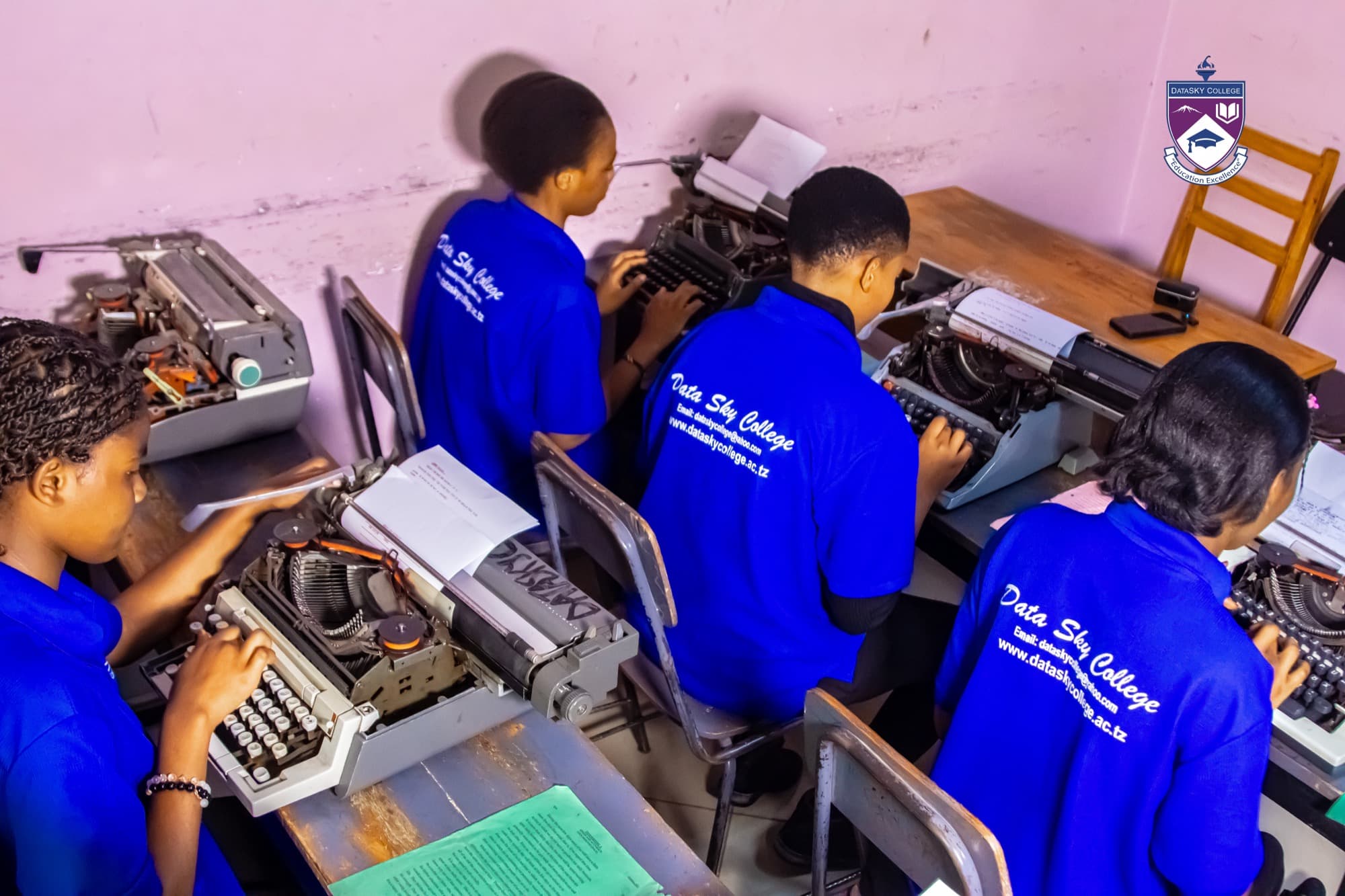 An overhead view of Datasky College learners at work during a practical training session